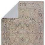 Back view showing light-colored backing and folded corner of the rug