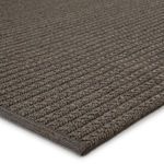 Close-up of textured polypropylene and polyester weave showing edge binding