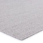 Close-up of flatwoven PET yarn texture and stitched edge in light gray and white