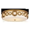 Gyges Flush Mount ceiling light with brass-finished wrought iron circular pattern and opaque white glass shade