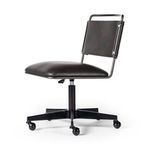 Close-up on thick seat cushion corner with smooth matte black upholstery