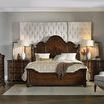 Leesburg Landscape Mirror viewed from side on dresser in elegant bedroom with tufted headboard and gray armchair