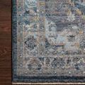 Samra Denim Grey Rug with intricate blue and grey medallion pattern and textured border on wood floor