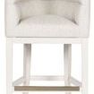 Front view of stool with metallic footrest accent contrasting the white wood base