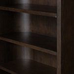 Interior close-up of Lockhart Bookcase shelves showing curved back panel and dark wood texture