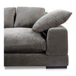 Close-up showing corduroy texture on armrest, seat cushion, and accent pillow of Plunge slipper chair