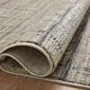 Close-up of curled edge reveals dense polyester pile and detailed texture of Soho Pebble Charcoal rug