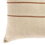 Close-up angled view of pillow corner highlighting striped woven texture and soft edges