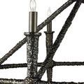 Close-up focus on Blackthorn Chandelier column and arm texture with lit candle flame bulb