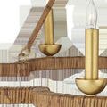 Close-up of candle-style light and textured rattan on scalloped frame of Savoie Chandelier
