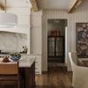Close-up of interior shelves in Finley Cabinet with ceramic bowls and woven basket on natural oak wood