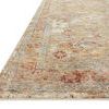 Close-up angled view showing detailed texture and pile height of the Gaia Gold Taupe rug's patterned corner.