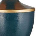 Close-up of textured navy blue body with gold rim detail on Travelogue lamp