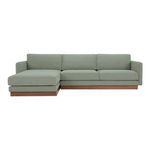 Mid-century style Vernon sectional sofa with sage green fabric and wooden plinth base, left chaise configuration