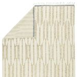 Rug reversed to show woven flat back with fringe and blue border