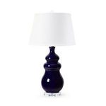 Table lamp with mako blue glazed ceramic base in a balanced, tailored form topped by a white fabric shade