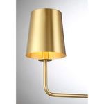 Close-up of single natural brass shade with brushed finish and spotlight effect