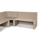 Interior view of U-shaped rattan banquette showing cushion placement and frame shape