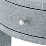 Close-up on silver round knob on the round drawer of the Claudette side table