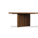 Close side angle showing end of table top and single broad vertical leg in natural wood finish