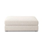 Straight-on front view of modular ottoman piece with neutral fabric