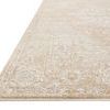 Low angle side view highlighting thin edge and pile texture of beige and silver traditional rug