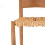 Close-up showing junction of woven seat and wooden front leg