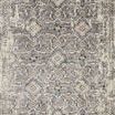 Top-down view showing full pattern of grey and natural rug with intricate transitional design
