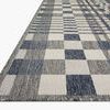 Close-up angled view showing the rug's woven texture and clean finished edges