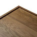 Partial view focusing on smooth wood surface and slight color variations in light oak finish