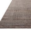 Angled low view showing the textured pile and edge detail of the Thorne Stone Rug