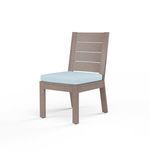 Laguna Armless Dining Chair with driftwood-look aluminum frame and light blue seat cushion