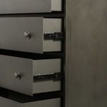 Side close-up focusing on metal drawer slides extended under two drawers