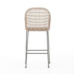 Close-up of tight wicker weaving and rounded armrest edge