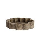 Organic shaped brown marble tray with ribbed texture and irregular scalloped edges
