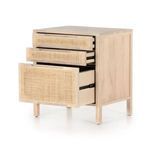 Close-up of natural cane pattern on the drawer fronts with integrated wood handle