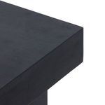 Angled side view showing solid corner of black wash desktop on Tilda desk