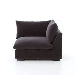 Close-up of armrest and cushion join on deep charcoal fabric of armless sectional piece