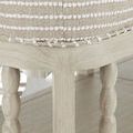 Close-up corner view highlighting rounded upholstery edges and carved wooden legs