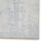 Corner close-up highlighting soft woven texture and delicate fringe along edge