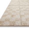 Side angle close-up showing Silas rug’s texture, thickness, and subtle pile height with geometric pattern in oatmeal and s...
