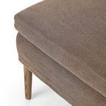 Close-up of junction between seat cushion and leg showcasing craftsmanship on Aurelia Dining Banquette