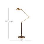 Close-up of lamp’s fluted faux leather stem meeting the round flat brass base with metallic sheen