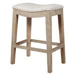 Three-quarter angle view showing the stool’s beveled saddle seat and four-way footrests on distressed oak legs