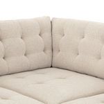 Detail of inner corner seat cushions with tufted back and seat upholstery