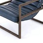Close detail of dark wood armrest showing smooth finish and joinery