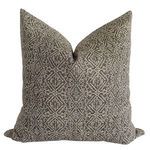 Square pillow with tan patterned linen fabric on a brownish gray background