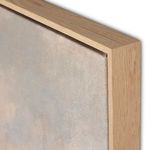 Close-up of natural wood frame corner with visible wood grain surrounding canvas painting