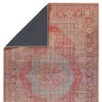 Corner folded to show dark non-slip backing on the rug