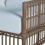Close-up of sofa seat corner framing with woven burlap texture and plush white cushion